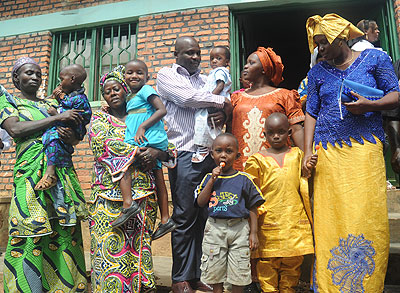 Children being adopted by caregivers from an orphanage that closed shop recently. The New Times/  File.