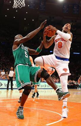 J.R. Smith #8 of the New York Knicks is fouled by Kevin Garnett #5 of the Boston Celtics during Game five of the Eastern Conference Quarterfinals. Net photo