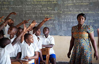 A female teacher in class.  Very few have risen into leadership positions, statistics say. The New Times/ Timothy Kisambira.  