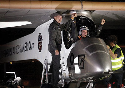 The plane crew salute spectators after landing at Sky Harbour International Airport in Phoenix. Net photo