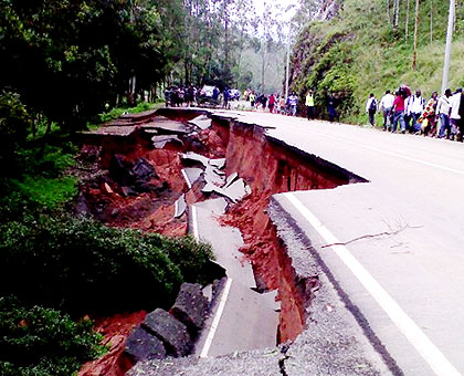 The cracks caused by heavy rain, on Saturday, on part of the Kigali-Musanze road have paralysed direct travel. The New Times/ J. Mbonyinshuti.