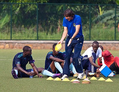 Goran Kopunovic, seen here giving instructions to his players, believes the title race of far from over and thinks Police have a very good chace of winning the league.  The New Times / File.