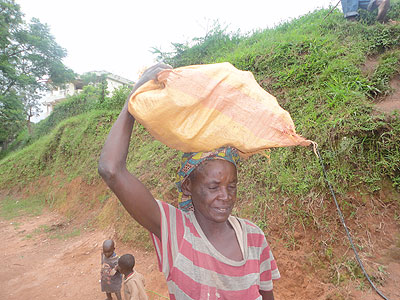 Nyinawintwari,70, says she makes a living by  working on other peopleu2019s farms, transporting sands and cleaning compounds. The New Times / File.  