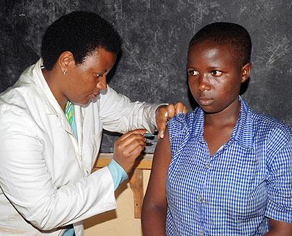A young girl gets cervical cancer immunisation. The Sunday Times / John Mbanda.