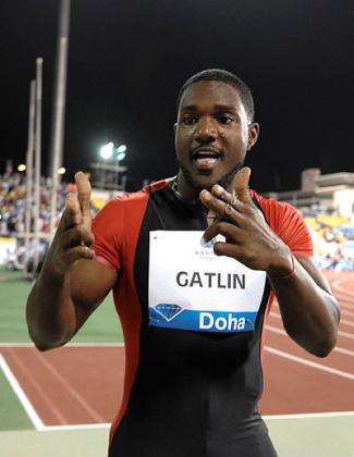 Justin Gatlin celebrates after winning the 100m in Doha. Net photo.