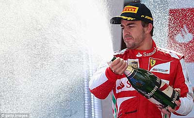 The Spaniard takes a well-deserved gulp of champagne on the podium. Net photo.