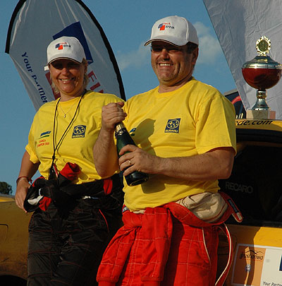 Giancarlo Davite (right) and his navigator Slyvia Vindevogel celebrate in a past national rally. The New Times / File.