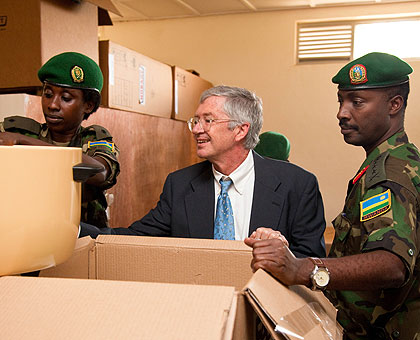 Donald W. Koran (C), the US ambassador to Rwanda and Lt. Gen. Charles Kayonga, RDF Chief of Defence Staff inspect some of the equipment donated by the US government to the Rwanda Defence Forces yesterday. The New Times / Timothy Kisambira.