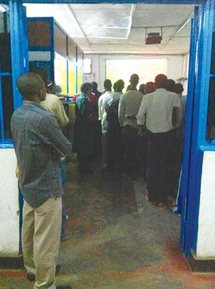 Anxious fans waiting for a match after betting. New Times photo