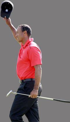 Tiger Woods celebrates after making birdie on the par 4 18th hole during the final round of the Memorial Tournament. Net photo.