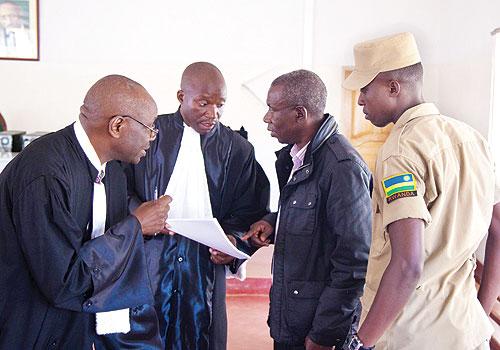 Prosecution on Monday objected to Charles Bandorau2019s (2nd R) request for bail, saying the accused stands charged of serious crimes. Sunday Times/T. Kisambira.