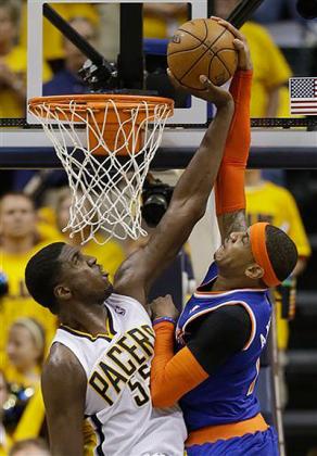 Indiana Pacers' Roy Hibbert (55) blocks the shot of New York Knicks' Carmelo Anthony, right, during the second half of Game 6 of an Eastern Conference semifinal. Net photo.