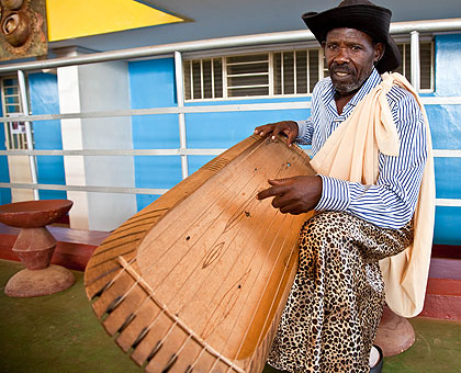 A man plays traditional herps during a cultural show last week. The New Times/ T. Kisambira.