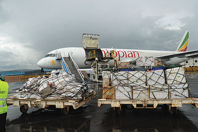 An Ethiopian Airlines plane prepares to load cargo at Kigali International Airport a few weeks ago. Exporters have been urged to increase output to satisfy regional markets.  The New Times / John Mbanda