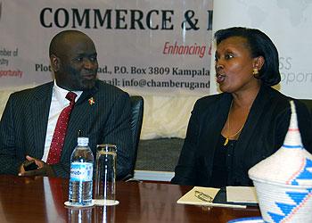 The Uganda National Chamber of Commerce and Industry (UNCCI) President Olive Kigongo chats with Burundiu2019s Ambassador to Uganda Jean Bosco Barege during the conference.