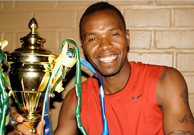 Adolphe Mutoni admires his best player accolade won in 2012. The New Times/ Courtesy.