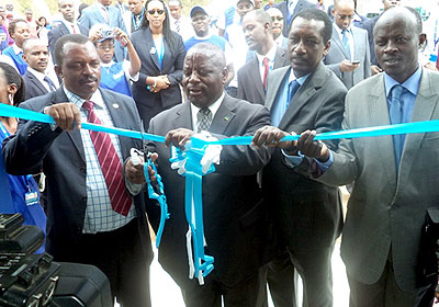 Governor of Northern Province, Bosenibamwe (2L) and James Gatera, CEO of Bank of Kigali (2R) officially launch the bank's agency banking platform. Courtesy photo.