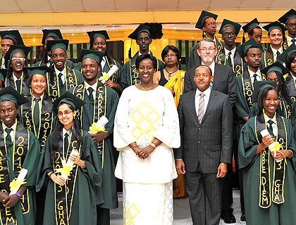 The First Lady, Jeannette Kagame; Green Hills Academy Board Chairman, Faustin Mbundu; headmaster, Ron Wallace; and secondary school principal Alpana Mukherjee pause for a photo with the students after the graduation ceremony yesterday.