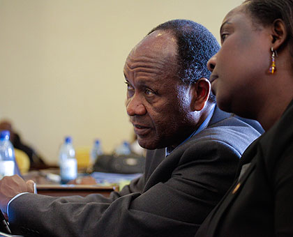 Jesca Eriyo (R), the EAC deputy secretary-general for productive and social sector, talks to Dr Julius T. Rotich the deputy secretary-general for political federation. The New Times/ Timothy Kisambira.