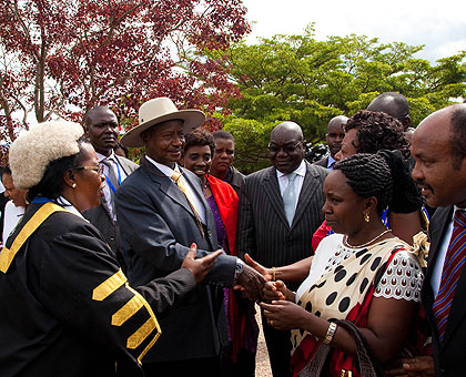 Speaker Zziwa (L) introduces EALA legislators to President Museveni in Kigali. The New Times/File