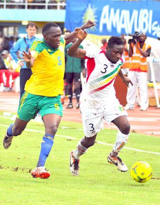 Meddy Kagere battles with Mali's full back Adama Tamboura during the last qualifier at Amahoro stadium. The two teams faceoff again on Sunday in Bamako.  Saturday Sport / Plaisir Muzogeye.