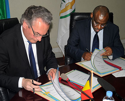 Amb. Gatete (R) and Labille sign the agreements in Kigali yesterday. Labille admitted Belgiumu2019s errors against Rwanda and called for stronger ties. The New Times/John Mbanda