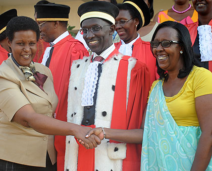 Rwabuhihi (R) is congratulated by Minister Gasinzigwa as Chief Justice Rugege looks on.  Saturday Times/ John Mbanda.