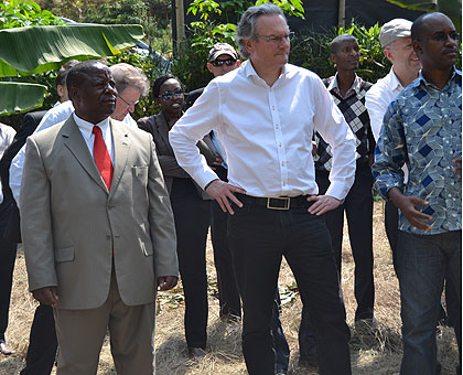 Labille and Northern Province Governor,  Aime Bosenibamwe, tour a banana plantation.   Saturday Times/ Jean du2019Amour Mbonyinshuti