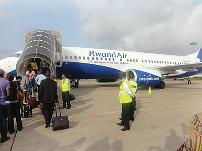 RwandAir passengers disembarking at the Kotoka International Airport in Accra . The New Times / Peterson Tumwebaze