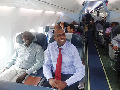 Mirenge and other passengers aboard RwandAiru2019s inauguration flight. The New Times / Peterson Tumwebaze