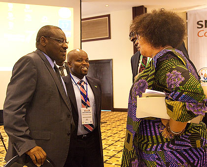 Dorothy Gordon, the director-general of Ghanau2019s Advanced Information Technology Institute (R), chats with the Ministers for Finance and Economic Planning, Amb. Claver Gatete (L) and Youth and ICT Jean Philbert Nsengimana in Kigali yesterday. The government has started an initiative to apply the power of ICT in development agenda to transform the social and economic development of the country.  The New Times/ Timothy Kisambira.