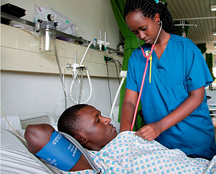 A nurse at King Faisal Hospital Rwanda treats a patient last year. the governmentu2019s plan is to have all institutions of higher learning to be under the supervision of the Ministry of Education.  The New Times/File.