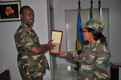 Gen. Kayonga and Col Leterbrhan Kahasy exchange a gift.   The New Times/Courtsey. 