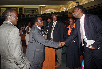 Ntawukuliryayo (L) introduces his Kenyan counterpart, Ekwee Ethuro (C) to the Rwandan Senate yesterday.    Saturday Times/ John Mbanda.