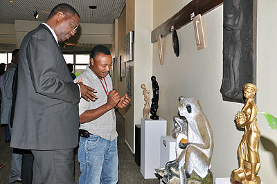 Minister  Mitali (L) admires some art pieces at the exhibition yesterday.   Saturday Times/ John Mbanda. 