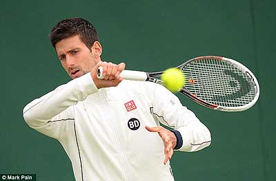 Djokovic's warm up for his assault on Wimbledon was interrupted by the rain. Net photo.