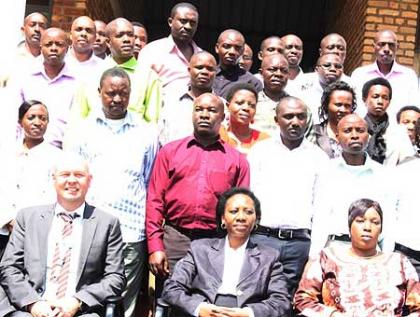 Deputy Chief Justice Kayitesi (C), UNDP Country representative  Lootsma (L) and NHRC Chair Nirere (R) in a group photo with some participants.   The New Times /JP Bucyensenge