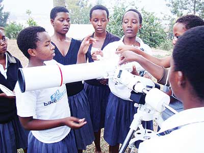 Students assembling a telescope. The New Times / Irene Nayebare.