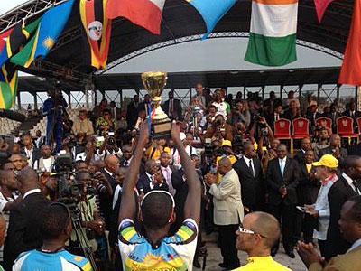 Team Rwanda captain Emmanuel Rudahunga  (C) and team mate Joseph Biziyarmye (L) after being crowned winners of 2013 Tour du Congo. Sunday Sport/Courtesy