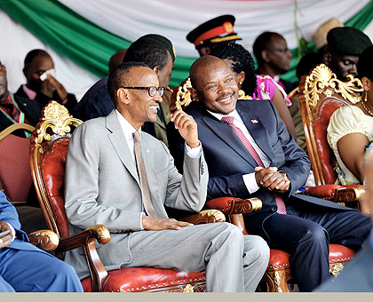 Presidents Kagame (L) and his host Nkurunziza chat during celebrations to mark Burundiu2019s 51st Independence Day celebrations. The fete was also attended by Kenyan leader Uhuru Kenyatta and region officials. President Kagame reiterated the need to continue bilateral ties.  The New Times/ V. Urugwiro.