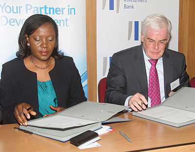 EADBu2019s Yeda (left) and van Ballekom sign the funding deal in Nairobi, Kenya.  The New Times / Courtesy 