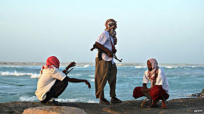 Pirates keep watch on the Somali coast. Net photo.