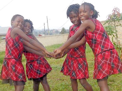 The children of Light House Home sharing a light moment. The New Times/Courtesy photo