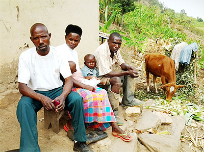 Ntawigira (L) and his wife, their 4-year-old child who survived death while malnourished and a friend. Net photo.