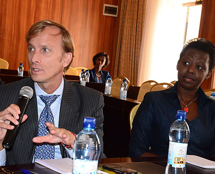 Global Fundu2019s Mark Dybul and Dr Anita Asiimwe, the State Minister for Primary and Public Healthcare during the meeting yesterday. The New Times/ Irene Nayebare