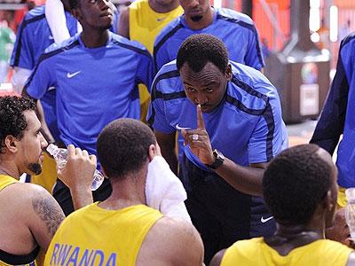 Head coach Moise Mutokambali giving tips to his players at halftime against Burkina Faso. Sunday Sport/Courtesy