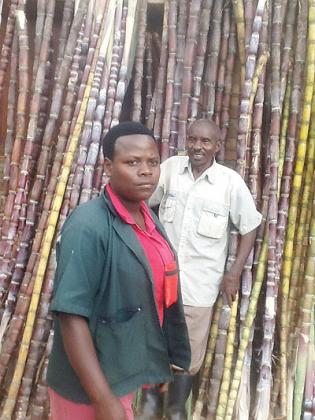 Nkurikiyimana and daughter wait for customers at Gakenke town. The New Times / Seraphine Habimana