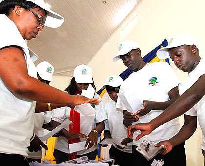 Volunteers during a past vote counting exercise. NEC says registration for next monthu2019s parliamentary election observers will close on Septmber 14. The New Times/John Mbanda