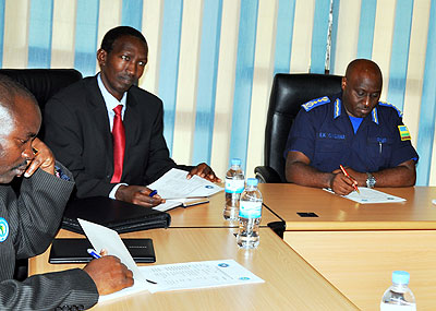 Maj. Gen Ndayirukiye  (C) and the IGP Gasana during a meeting at the police headquarters in Kacyiru yesterday. The New Times/Courtsey.   