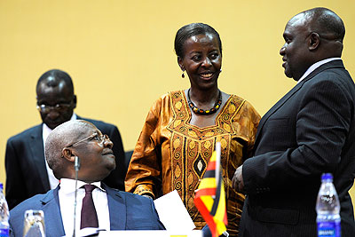 Rwandan foreign minister Louise Mushikiwabo (C) with her Ugandan counterpart Sam Kuteesa (L) and Ugandan defence minister Crispus Kiyonga at the ICGLR summit in Kampala on Septembe....